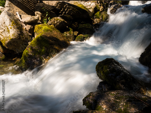 glacier brook from the buarbreen glacier on an sunny hike photo