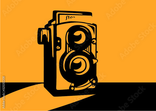 Hipster old vintage camera with shade, orange and black. Twin-lens reflex camera