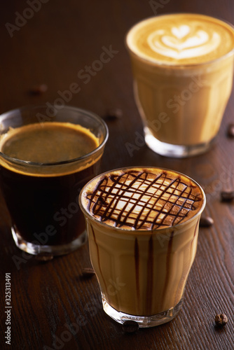 Wallpaper Mural Cups of latte and Cappuccino and espresso on table in cafe. Torontodigital.ca