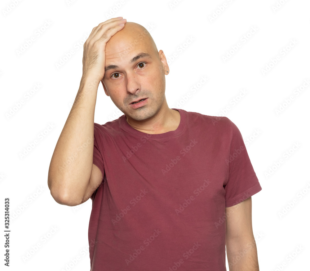 Sad man looking at camera. Bald guy isolated on white Sad man looking at camera. Bald guy isolated on white