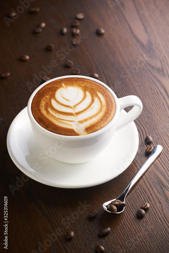 Wallpaper Mural Cup of latte or Cappuccino on table in cafe. Torontodigital.ca