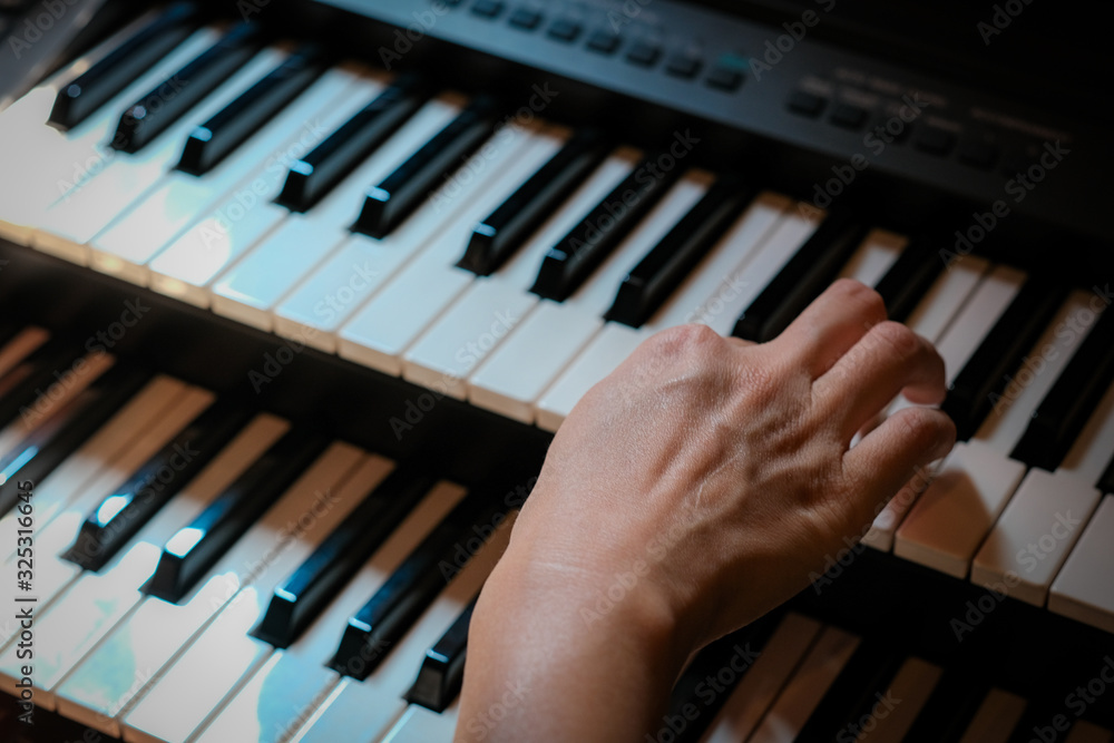 Fototapeta premium hands playing piano 