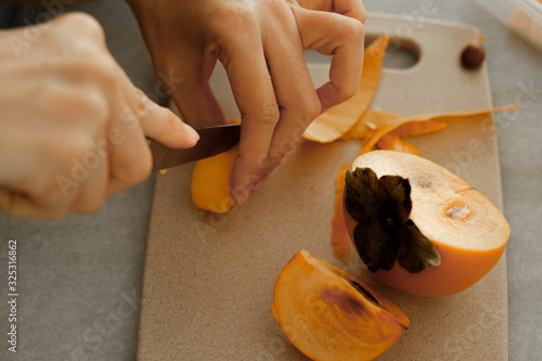 prepare making Persimmon with knife