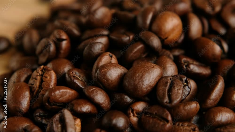Dark Coffee Grains. Coffee beans rotating. Close up of seeds of coffee. Dark Coffee Grains. Coffee beans rotating. Close up of seeds of coffee.