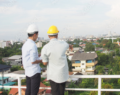 asian male engineer or foreman and architects Asian people are seeing to site from top view.