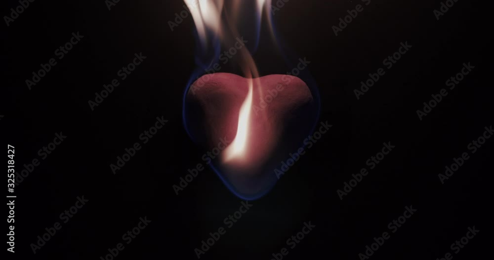 Slow motion closeup of a heart burning. Slow motion closeup of a heart burning.