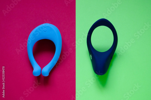 Sex toy. White Vibrator on a pink background photo