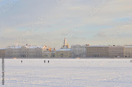 The Palace Embankment and frozen Neva river.