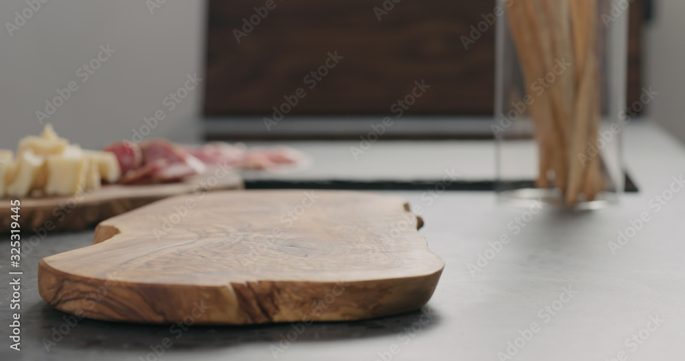 empty olive board on terrazzo countertop