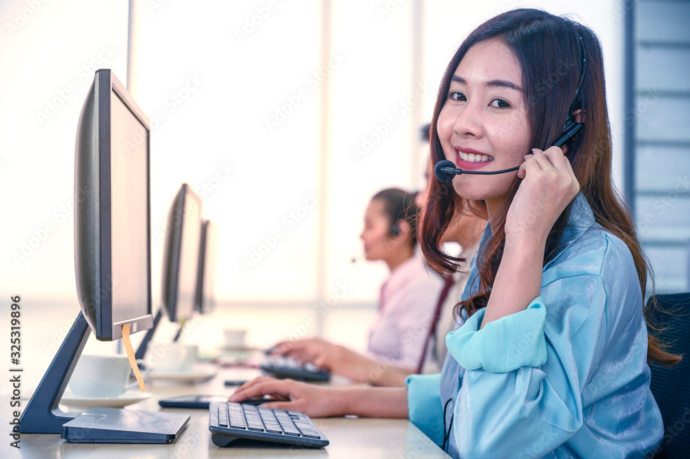 Young customer service women agent with headsets and computer working at office. Young customer service women agent with headsets and computer working at office.