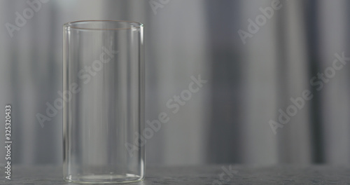 empty glass on gray marble terrazzzo countertop background