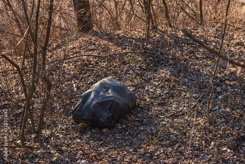 plastic bag littering the environment in the forest