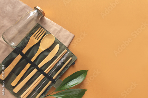 Set of Eco friendly bamboo cutlery  eco bag reusable coffee mug and water bottle. Sustainable lifestyle. Plastic free concept.