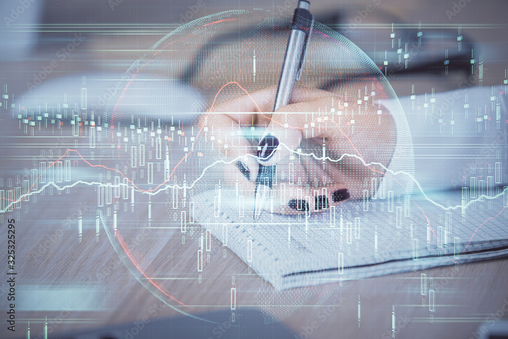 Multi exposure of hands making notes with forex chart huds. Stock market concept. Multi exposure of hands making notes with forex chart huds. Stock market concept.