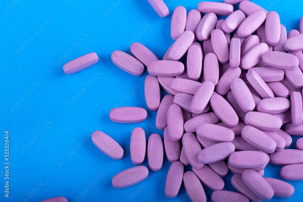 Heap of pills on blue background. Heap of pills on blue background.