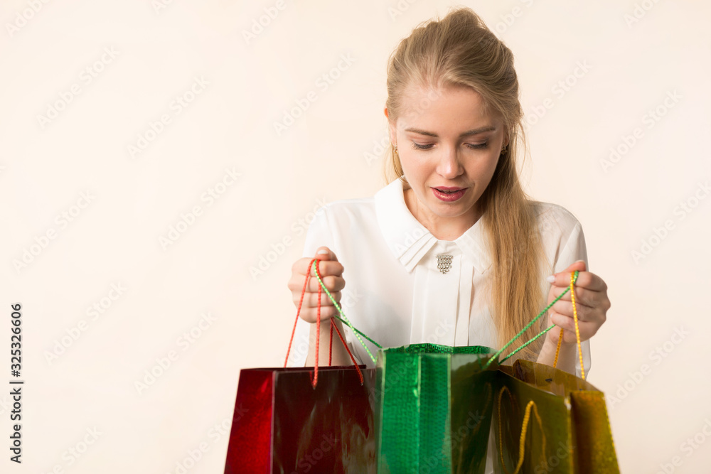 beautiful young woman with packages in hand