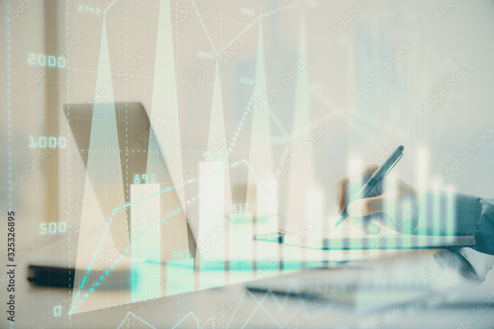 Double exposure of forex chart with man working on computer on background. Concept of market analysis. Double exposure of forex chart with man working on computer on background. Concept of market analysis.