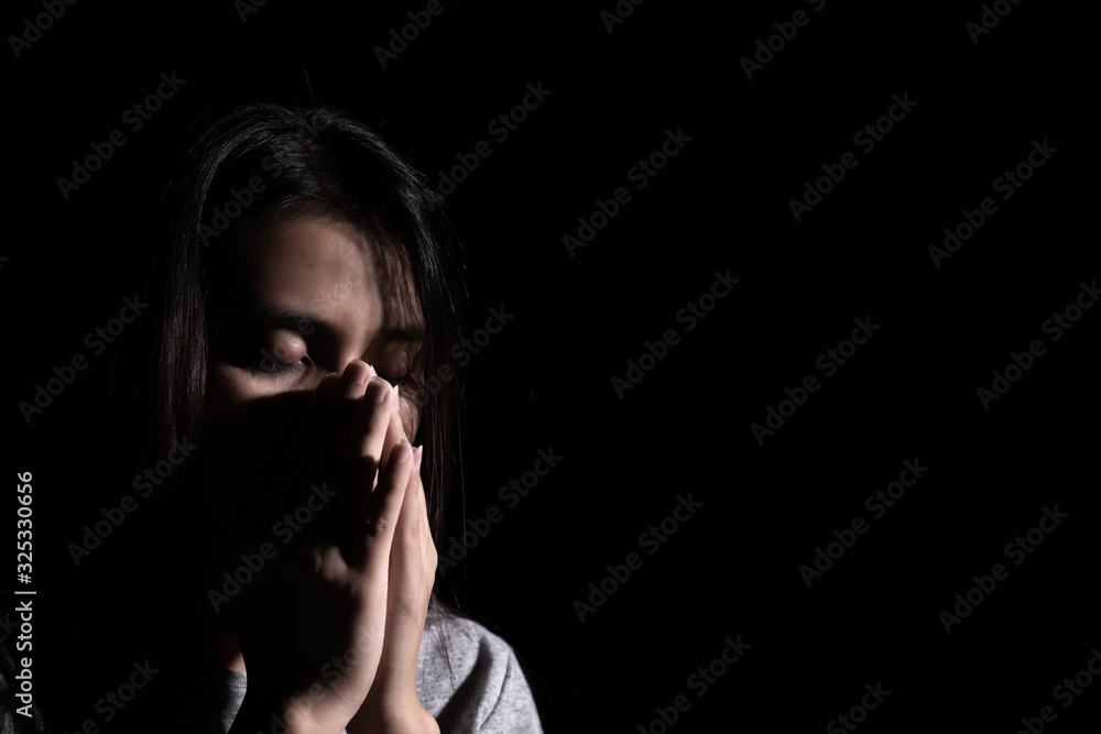 sad woman hug her knee and cry. Sad woman sitting alone in a empty room.