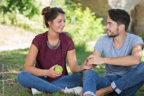 romantic young couple sharing an apple © auremar