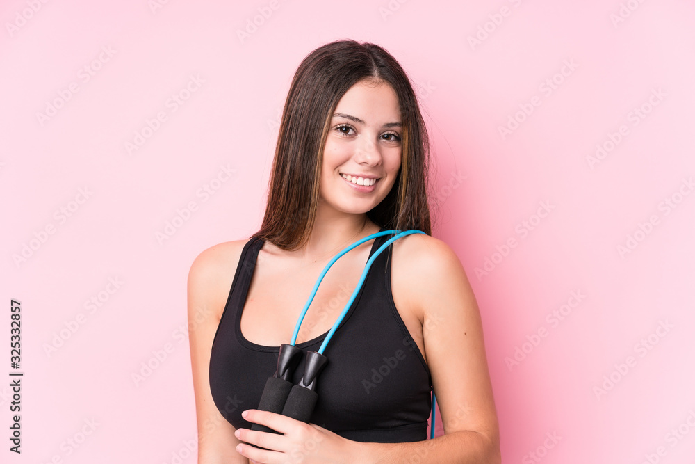 Young caucasian sporty woman holding a jump rope Young caucasian sporty woman holding a jump rope