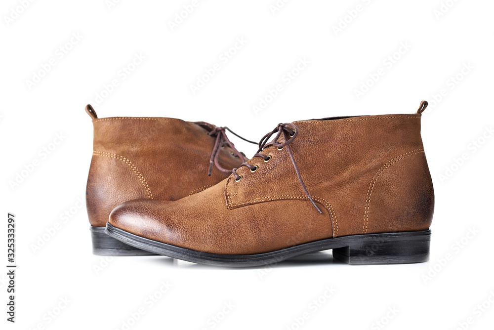 Pair of brown leather womens boots on the white background isolated Pair of brown leather womens boots on the white background isolated