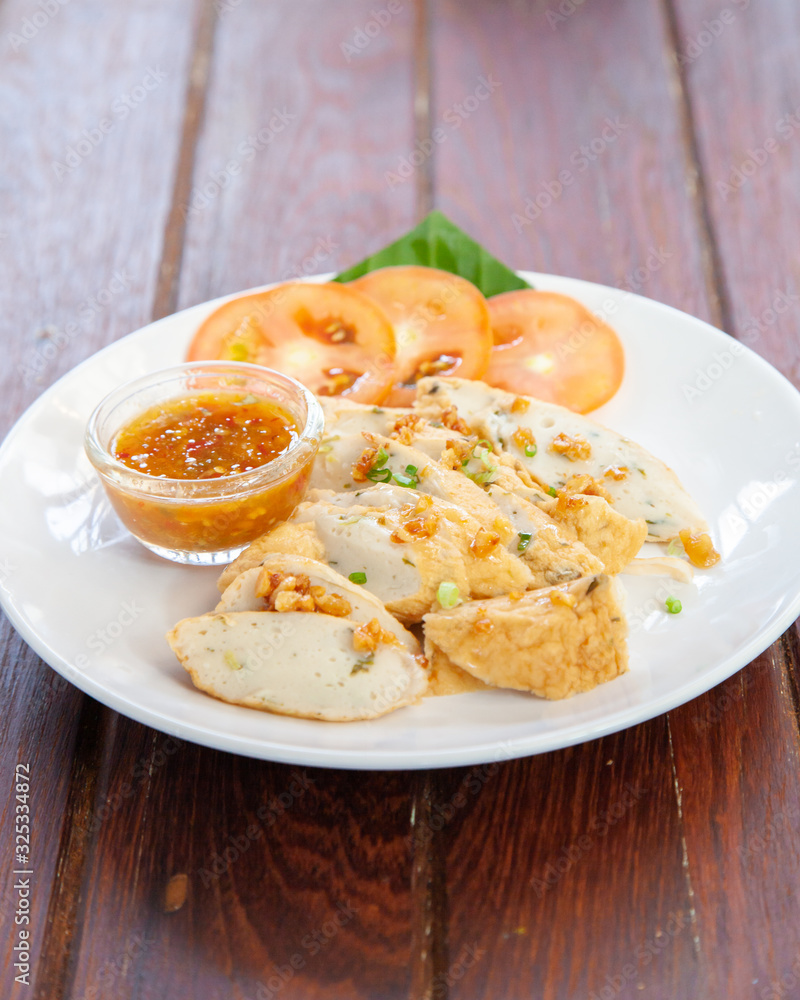 Sliced Chinese fish sausage with Thai spicy sauce Sliced Chinese fish sausage with Thai spicy sauce