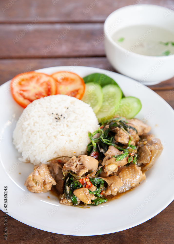 Rice topped with stir fried chicken and basil Rice topped with stir fried chicken and basil