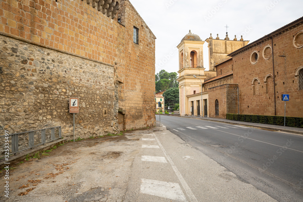 paved road passing by the Cattedrale del Santo Sepolcro Cathedral in Acquapendente city,  province of Viterbo, Lazio, Italy