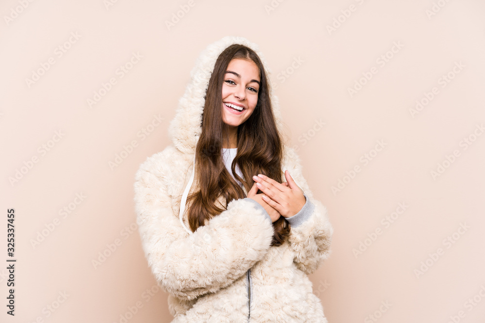 Young caucasian woman posing isolated has friendly expression, pressing palm to chest. Love concept. Young caucasian woman posing isolated has friendly expression, pressing palm to chest. Love concept.