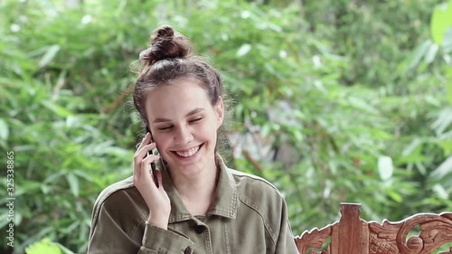 Young girl talking on the phone and smiling