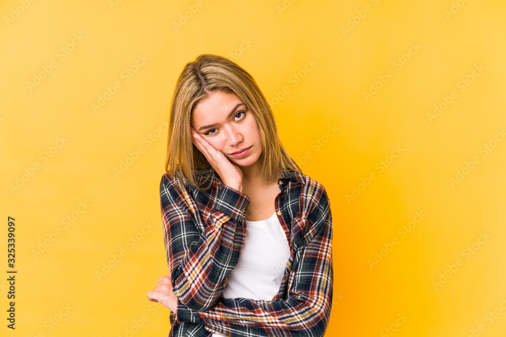 Young blonde caucasian woman isolated who is bored, fatigued and need a relax day.