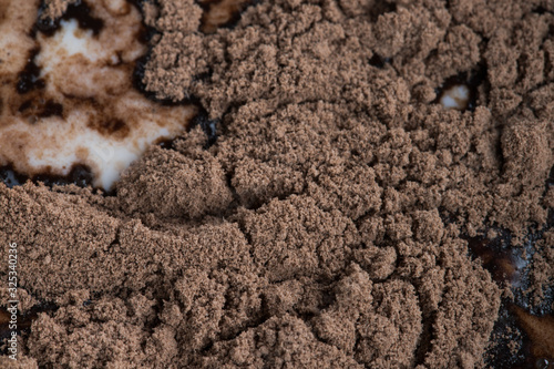 Close-up shot of cocoa poured into milk