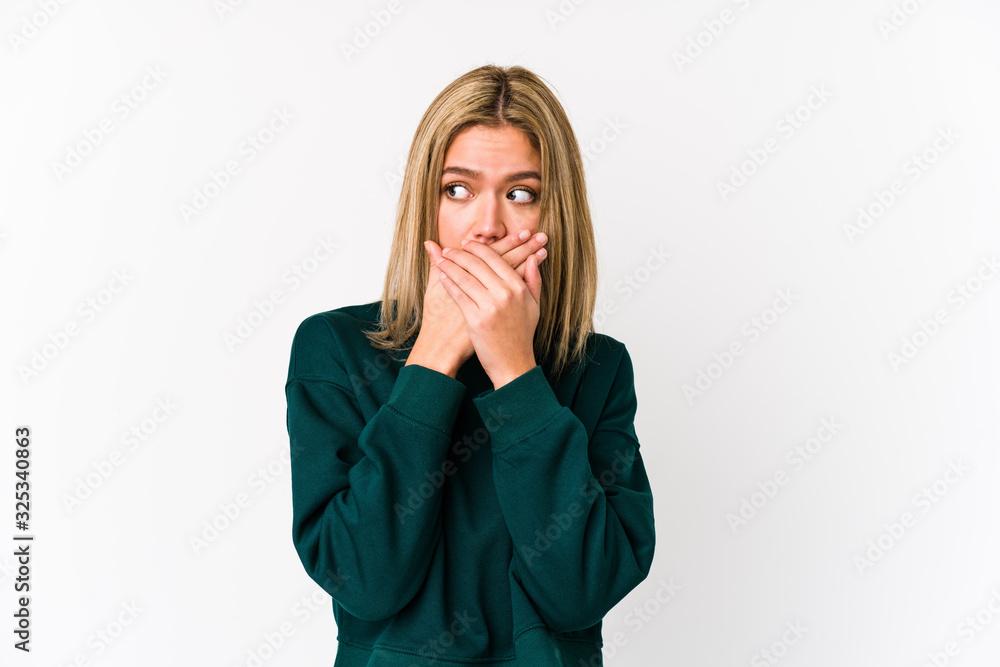 Young blonde caucasian woman isolated covering mouth with hands looking worried. Young blonde caucasian woman isolated covering mouth with hands looking worried.
