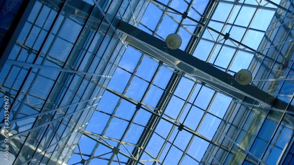 Modern urban architecture glass ceiling in an office building business center interior industrial construction structure Modern urban architecture glass ceiling in an office building business center interior industrial construction structure