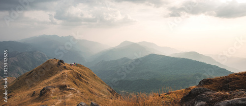 Panorama viewpoint and tent on the Mulayit Summit. The evening period, the grass is golden, which is moving according to the wind force. At Mulayit Taung in Myanmar is soft focus.
