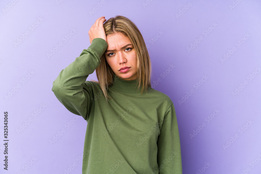 Young blonde caucasian woman isolated tired and very sleepy keeping hand on head. Young blonde caucasian woman isolated tired and very sleepy keeping hand on head.