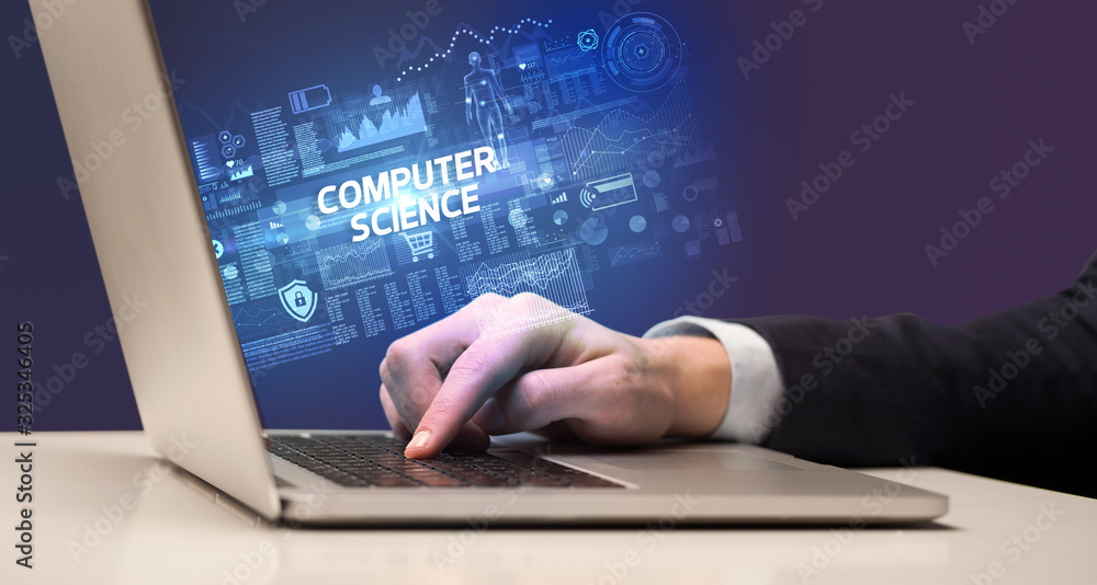 Businessman working on laptop with COMPUTER SCIENCE inscription, cyber technology concept Businessman working on laptop with COMPUTER SCIENCE inscription, cyber technology concept