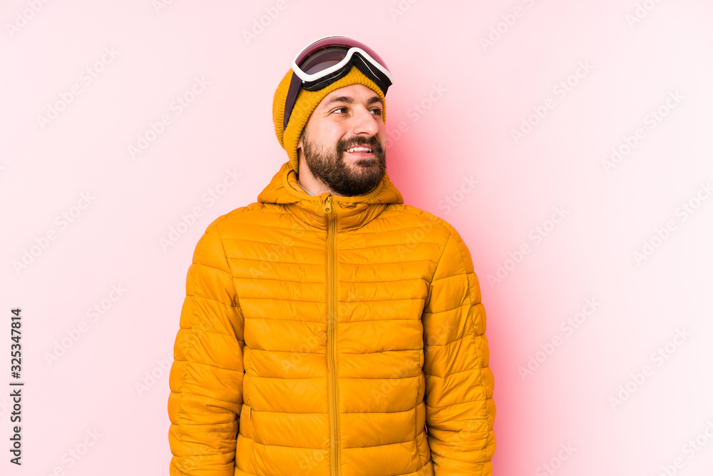 Young skier man isolated dreaming of achieving goals and purposes Young skier man isolated dreaming of achieving goals and purposes