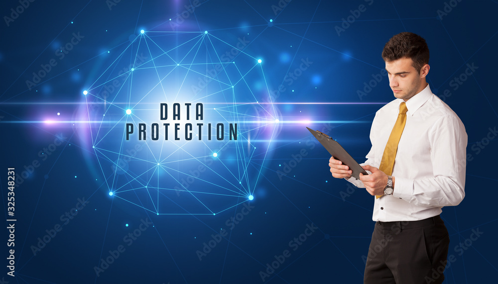 Businessman thinking about security solutions with DATA PROTECTION inscription Businessman thinking about security solutions with DATA PROTECTION inscription