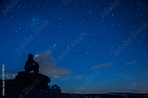 Man sitting down looking to the stars