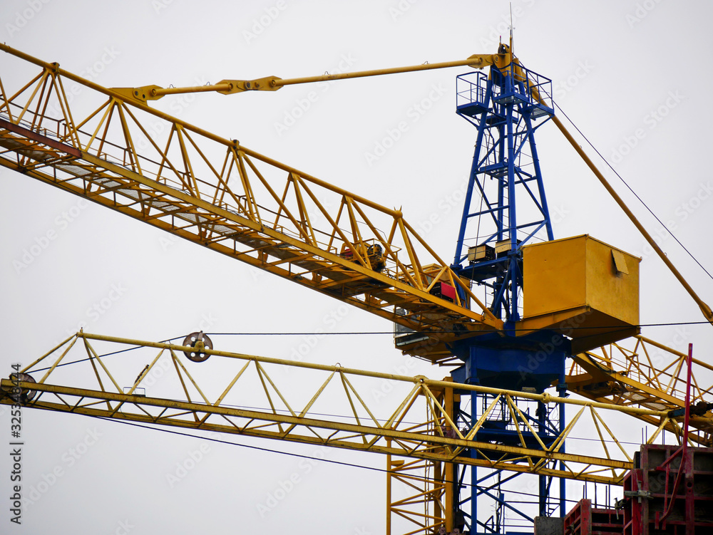 Crane. Self-erection crane near concrete building. Construction site. Crane. Self-erection crane near concrete building. Construction site.