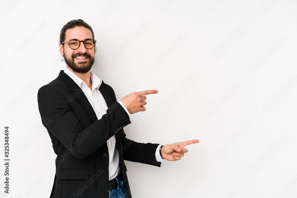 Young caucasian business man isolated on a white background excited pointing with forefingers away. Young caucasian business man isolated on a white background excited pointing with forefingers away.