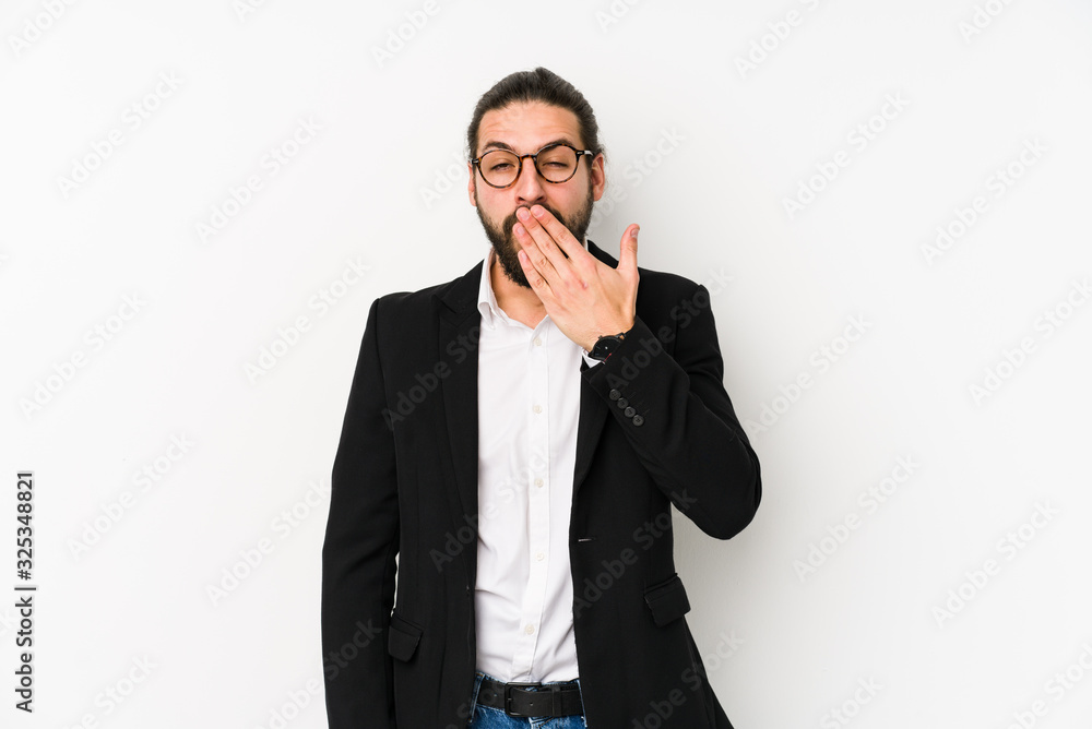 Young caucasian business man isolated on a white background yawning showing a tired gesture covering mouth with hand. Young caucasian business man isolated on a white background yawning showing a tired gesture covering mouth with hand.