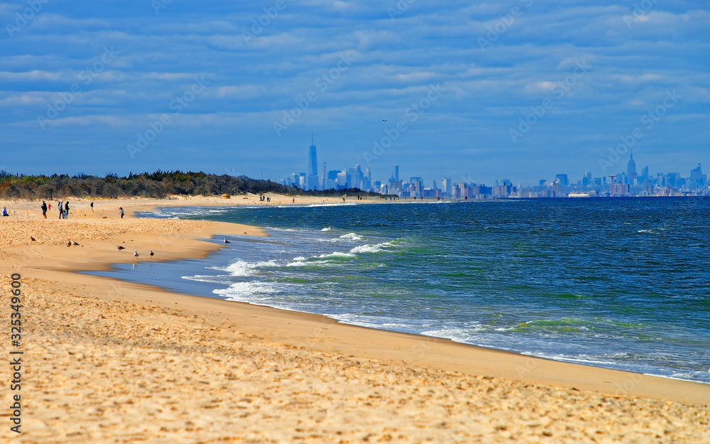 Atlantic Ocean shore at Sandy Hook with view on NYC