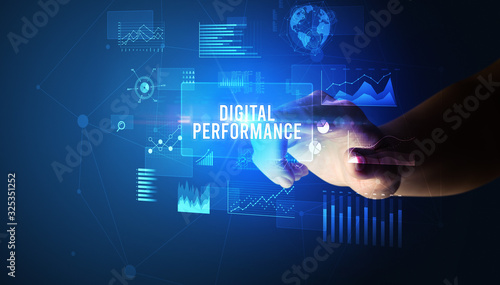 Hand touching DIGITAL PERFORMANCE inscription, new business technology concept