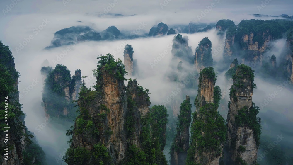 Mountain landscape scenery of rock formations in clouds. Zhangjiajie National Forest Park, Hunan, China.