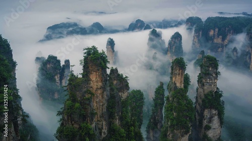 Mountain landscape scenery of rock formations in clouds. Zhangjiajie National Forest Park, Hunan, China. photo