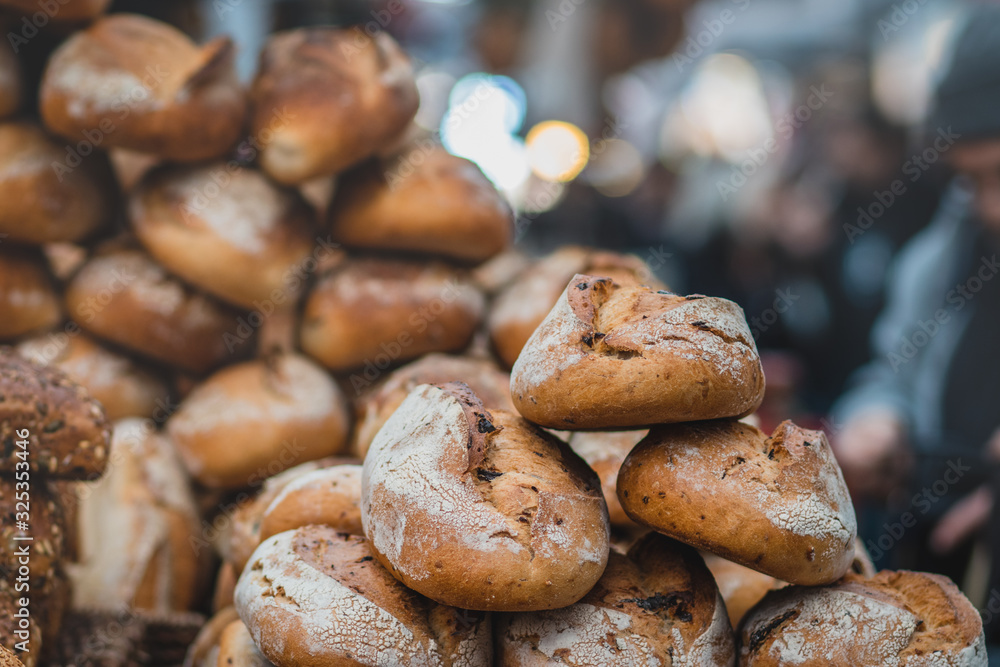 A pile of fresh bread made from whole flour. Crispy, blurred background. The Market, Jerusalem. A pile of fresh bread made from whole flour. Crispy, blurred background. The Market, Jerusalem.