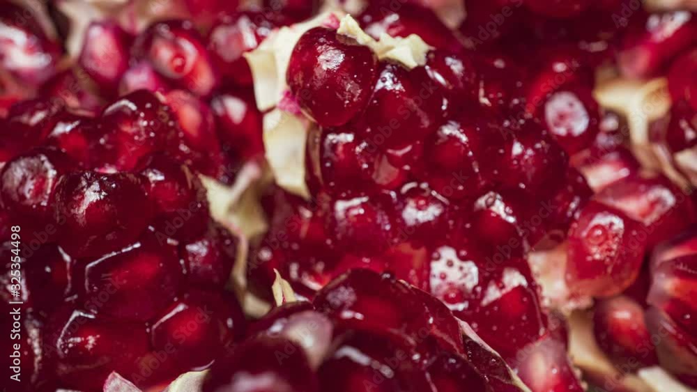 Rotating Pomegranate Seeds. Extreme macro of juicy pomegranate, rich in natural antioxidants. concept of red fruits, vitamins and natural antioxidants to the skin for beauty. Rotating Pomegranate Seeds. Extreme macro of juicy pomegranate, rich in natural antioxidants. concept of red fruits, vitamins and natural antioxidants to the skin for beauty.