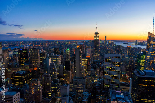 Manhattan downtown skyline in New York City, with Empire State Building and skyscrapers at sunset. © Bokicbo
